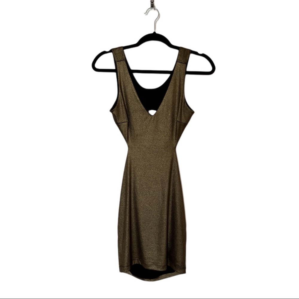 Bebe open back fitted metallic mini dress. Size Small